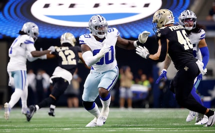 Dallas Cowboys defensive end DeMarcus Lawrence (90) looks to get around New Orleans Saints...