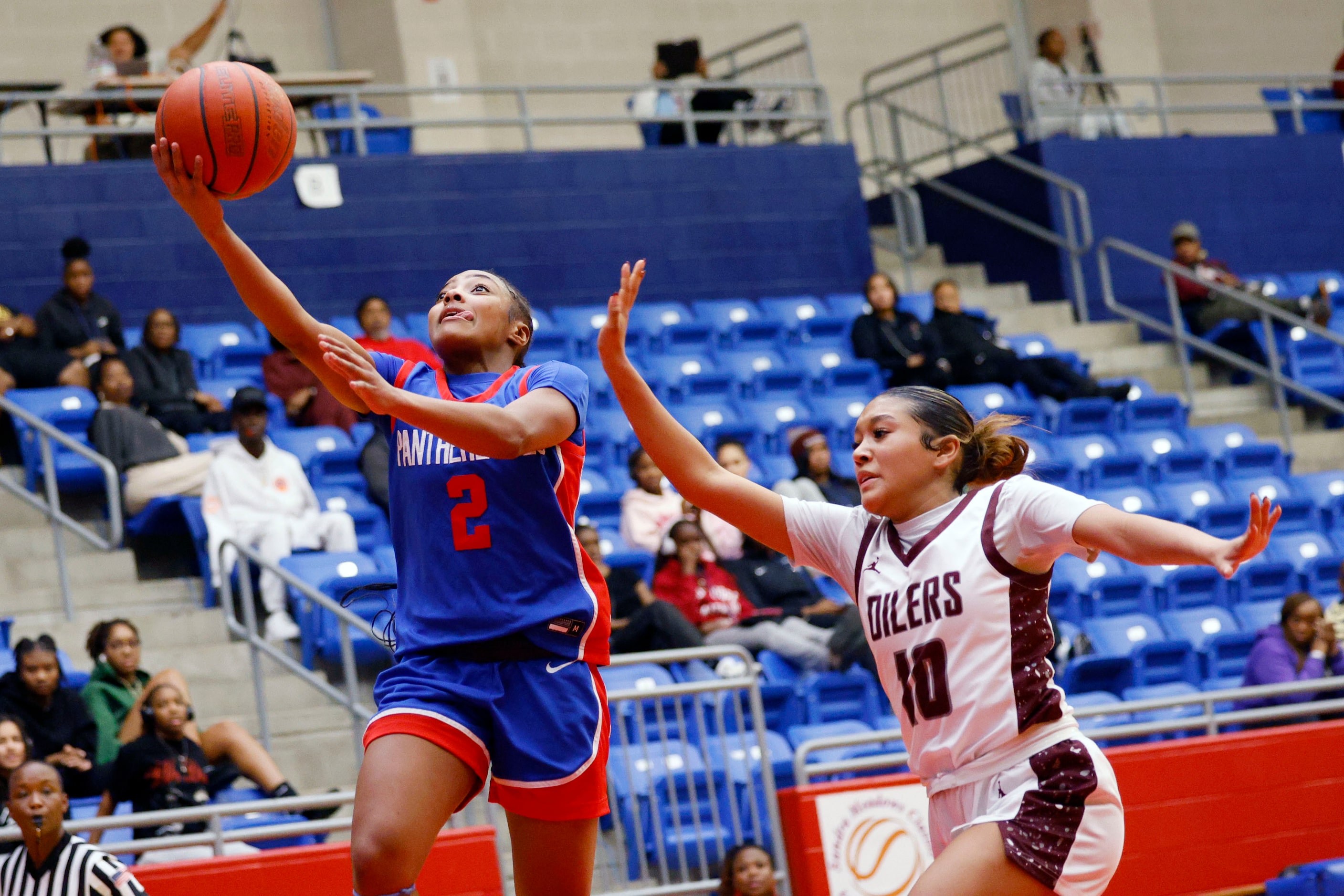 Duncanville's Aja Smith (2) lays up a ball as Pearland's Brylee Bonner (10) tries to stop...