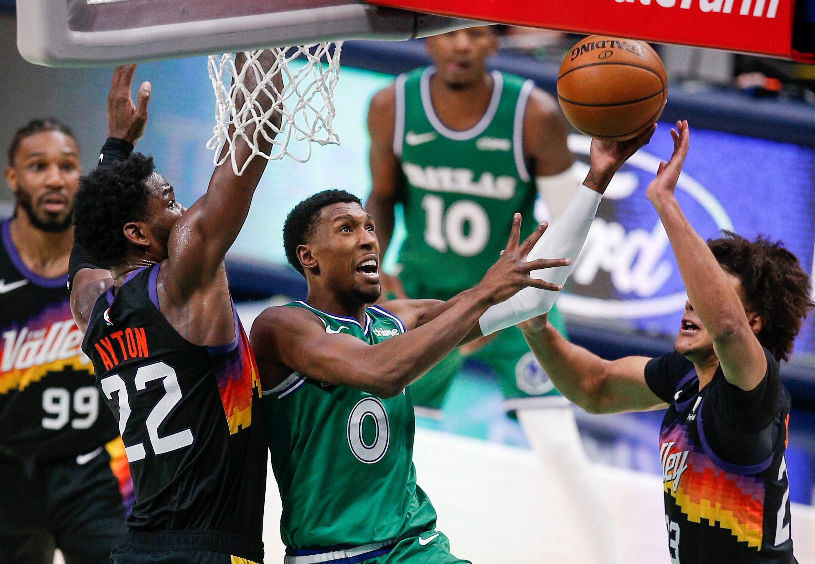 Dallas Mavericks guard Josh Richardson (0) attempts a layup as Phoenix Suns forwards Deandre...