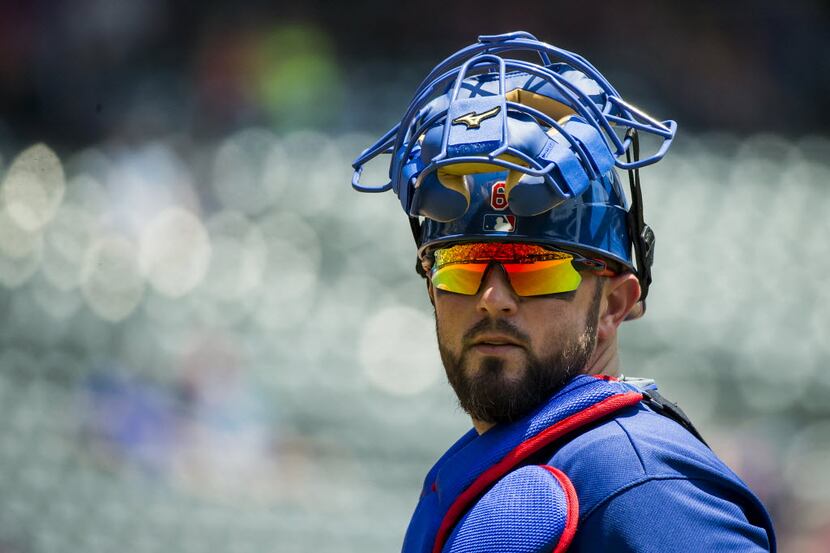 Texas Rangers catcher Bobby Wilson looks back to the dugout during the first inning against...