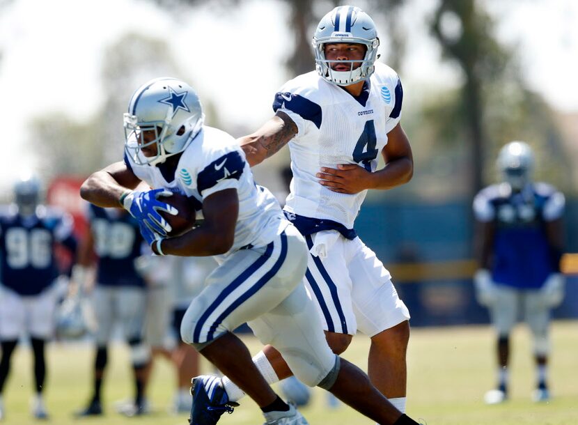 Dallas Cowboys quarterback Dak Prescott (4) hands the ball off to running back Alfred Morris...