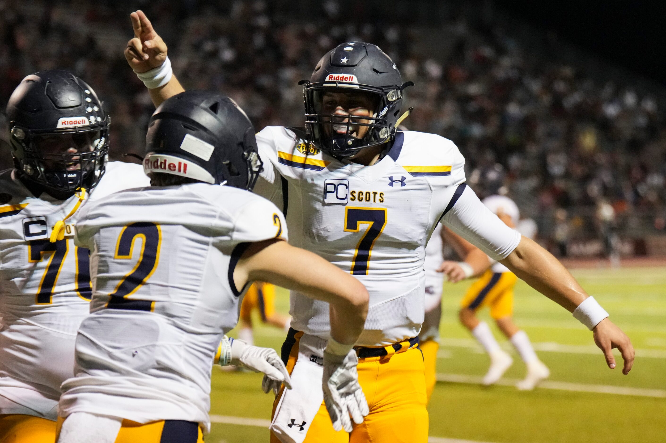 Highland Park wide receiver Grayson Schrank (2) celebrates with quarterback  Brennan Storer...