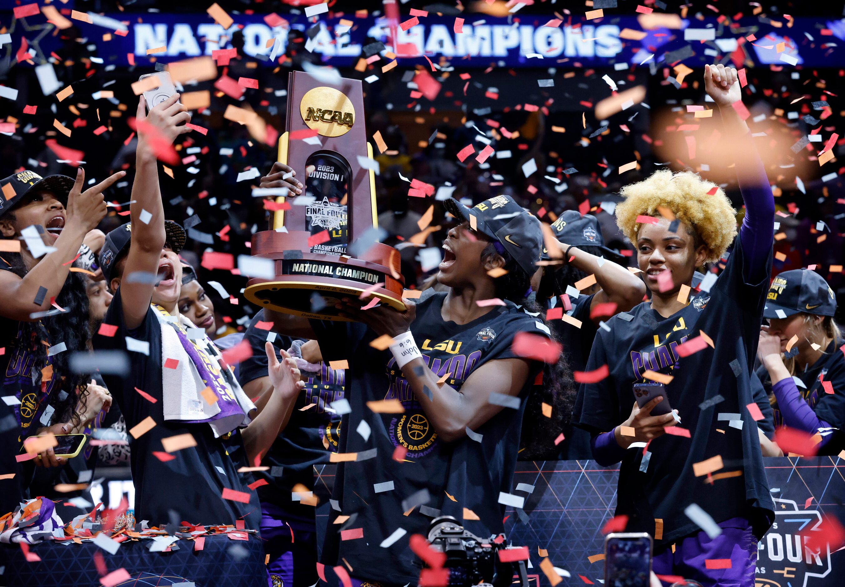 LSU Lady Tigers guard Flau'jae Johnson hoists the NCAA Women’s Basketball Championship...