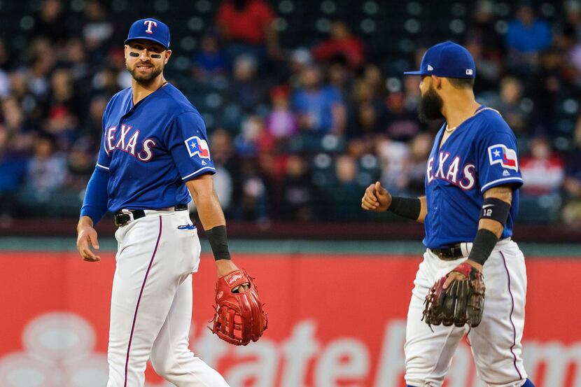 Texas Rangers outfielder Joey Gallo laughs with second baseman Rougned Odor during the...