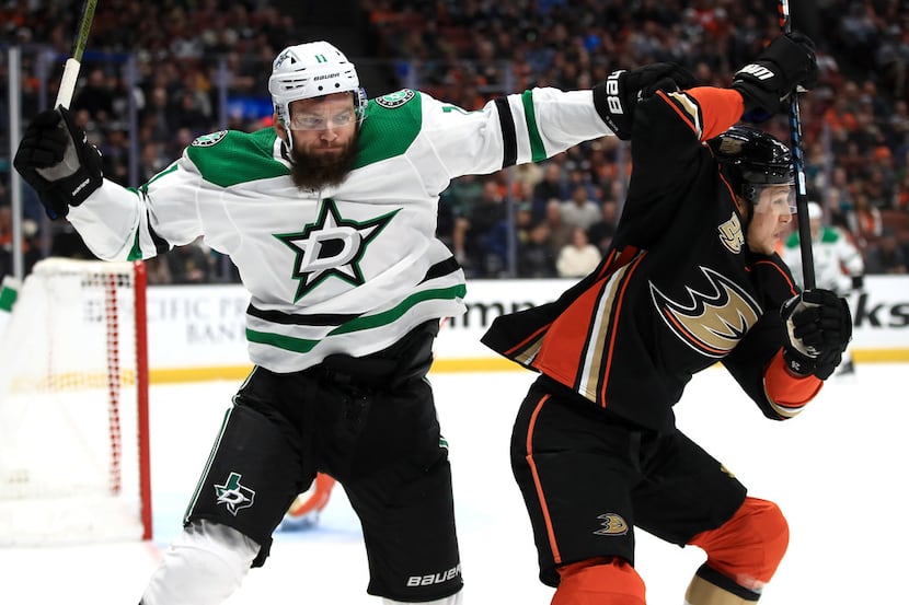 ANAHEIM, CA - DECEMBER 12:  Brandon Montour #26 of the Anaheim Ducks battles Martin Hanzal...