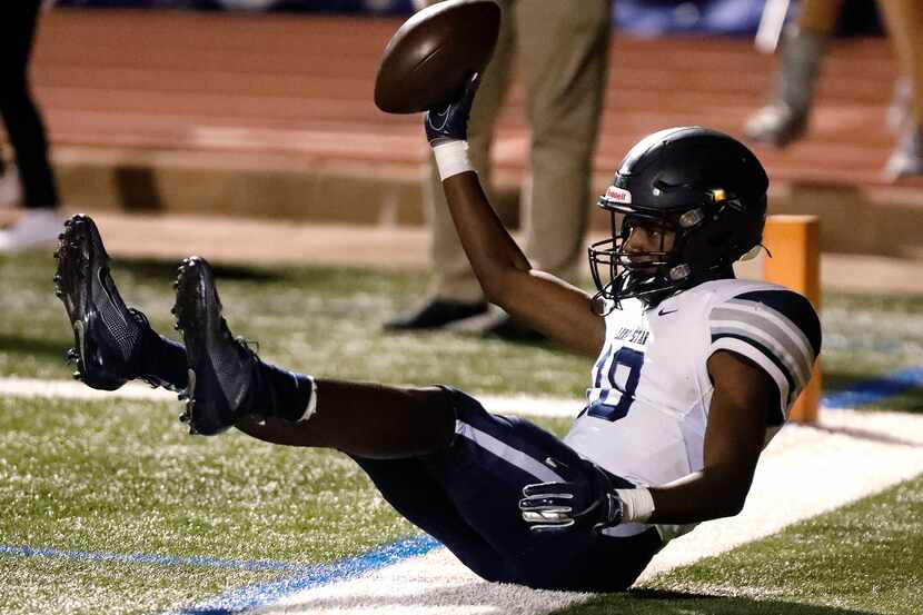 Lone Star High School wide receiver Marvin Mims (18) shows he held onto the ball as he lands...