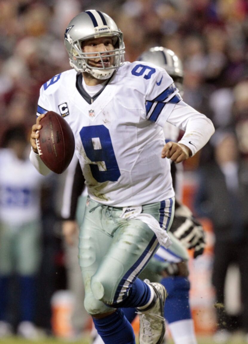 Dallas Cowboys quarterback Tony Romo (9) looks to make a play in a game against the...