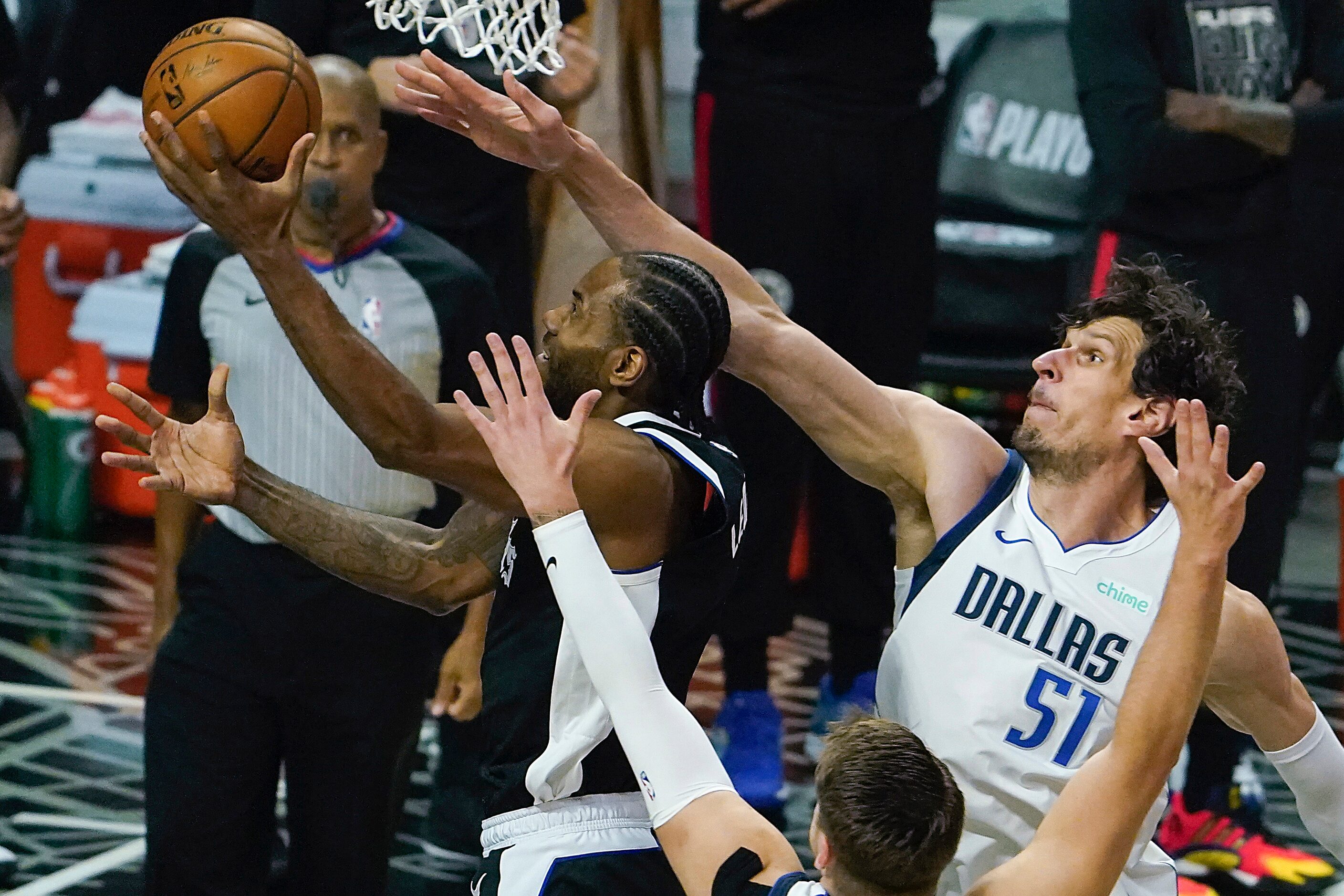 Dallas Mavericks center Boban Marjanovic (51) and guard Luka Doncic (77) defend a drive by...