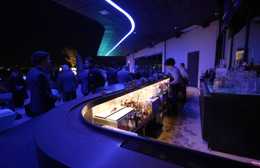 An outside bar on the 3rd floor outside deck serves guests. Cosm, the big immersive dome...