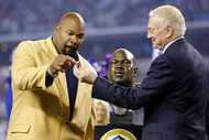 Former Dallas Cowboys guard Larry Allen receives his Hall of Fame ring from owner Jerry...