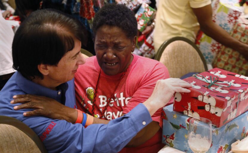 David Timothy, founder of the SoupMobil, gets a hug from Carol 'Mama' Hawkins, 58, after she...