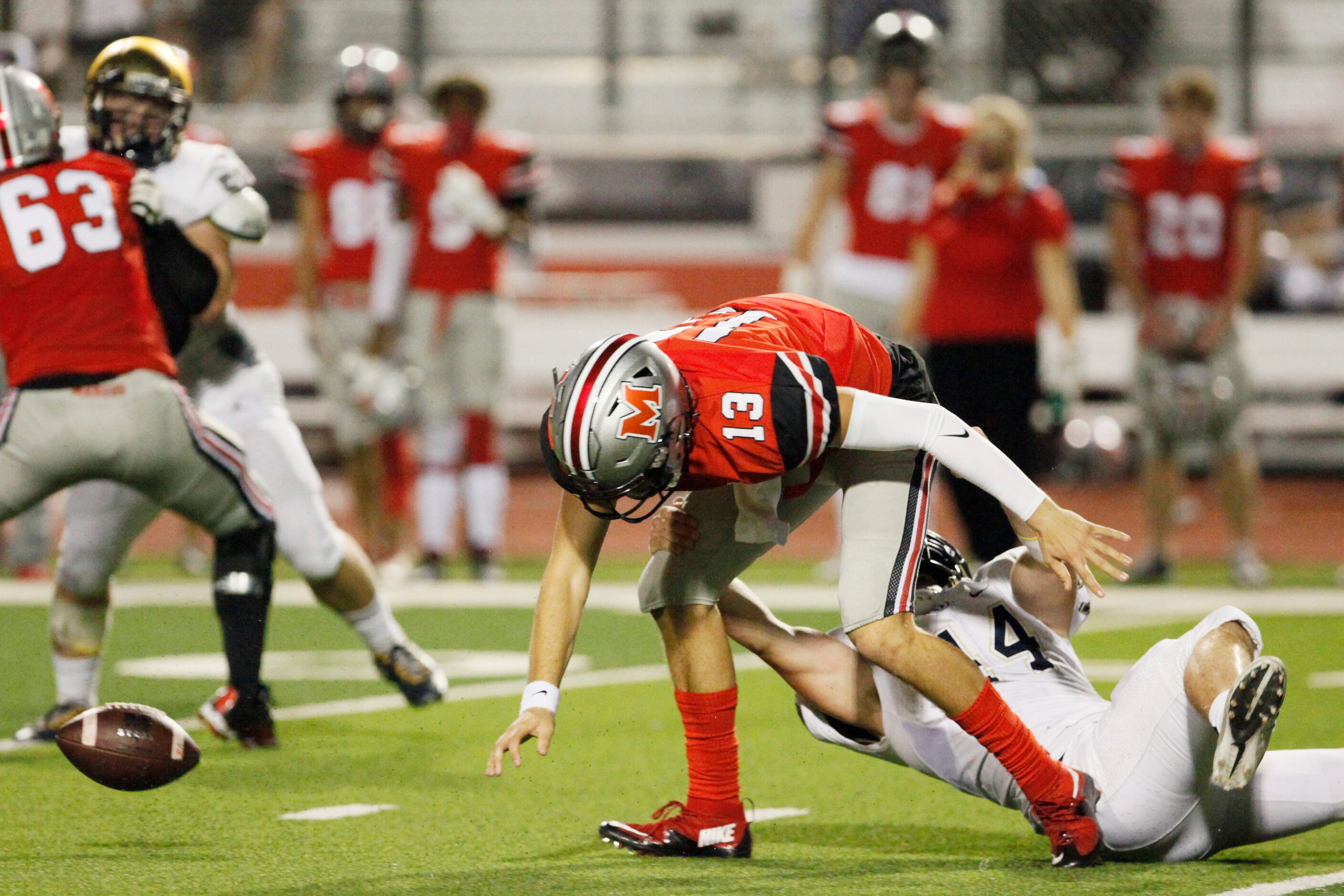 Jesuit senior linebacker Jack Judson (44) pulls down Flower Mound Marcus senior quarterback...