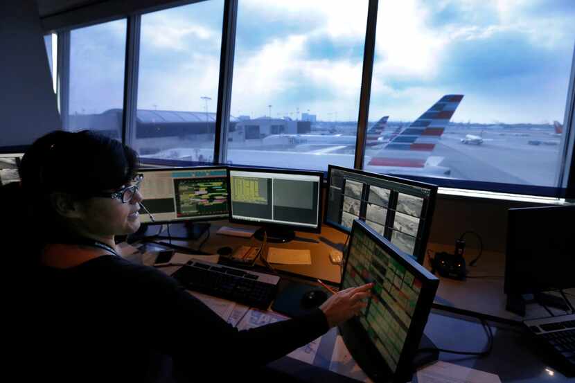 Airline Operation Control Center worker Anna Franco ensures an American Airlines Flight to...