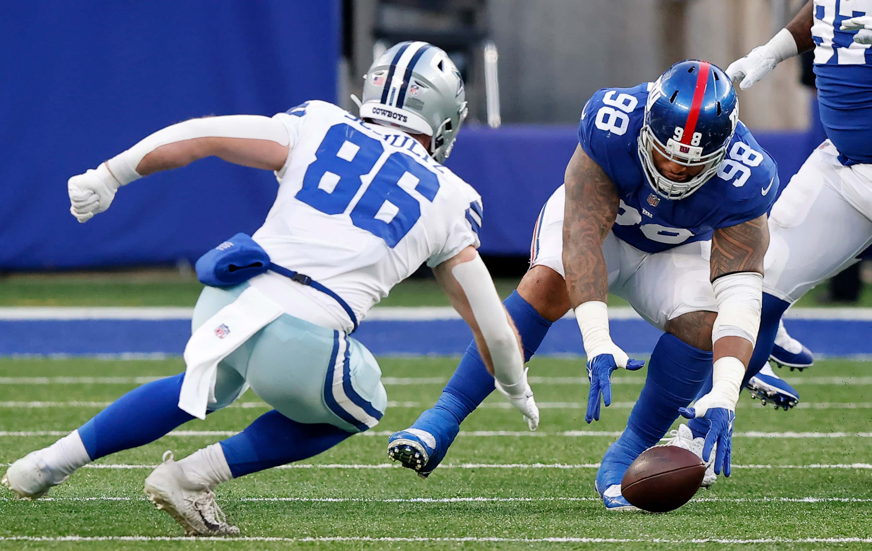 New York Giants nose tackle Austin Johnson (98) reaches for a strip sack fumble of Dallas...