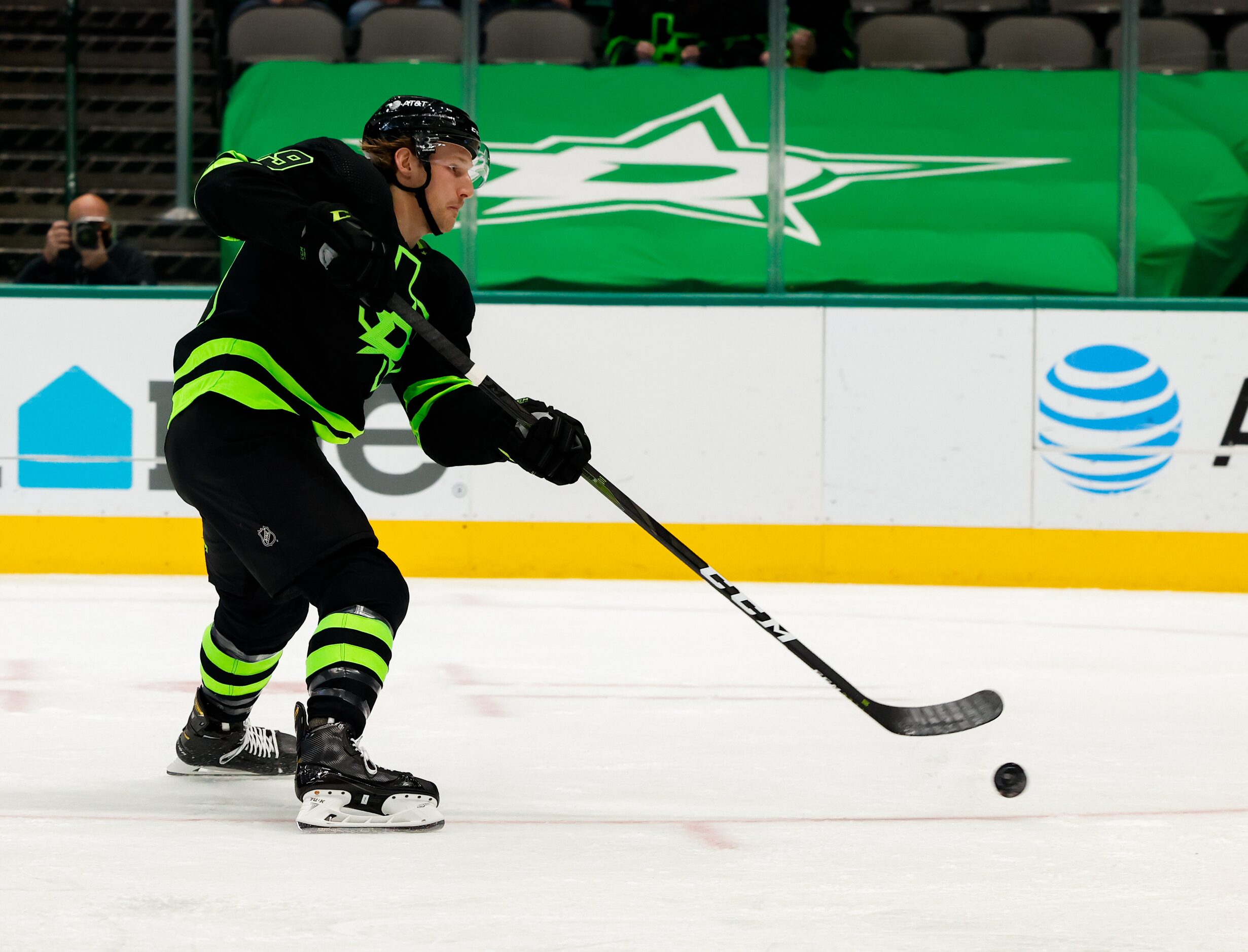 Dallas Stars center Rhett Gardner (49) hits towards the goal against Columbus Blue Jackets...