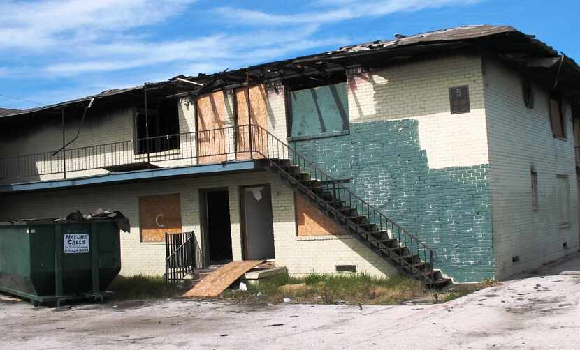  Now-demolished apartments on Grand Avenue in South Dallas, where invaders and drug users...