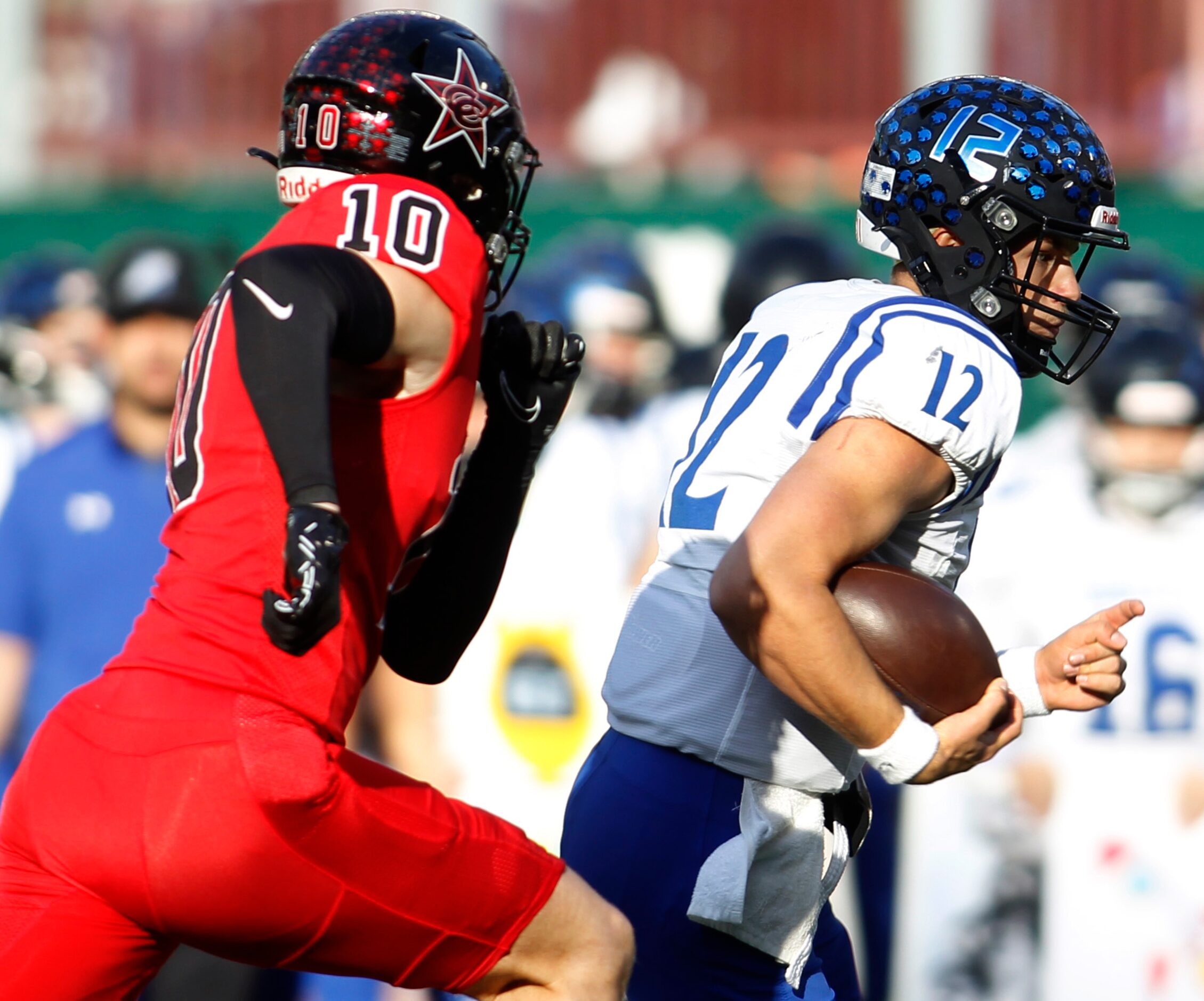 Byron Nelson quarterback Tom Von Grote (12), right, rolls out of the pocket as he is pursued...