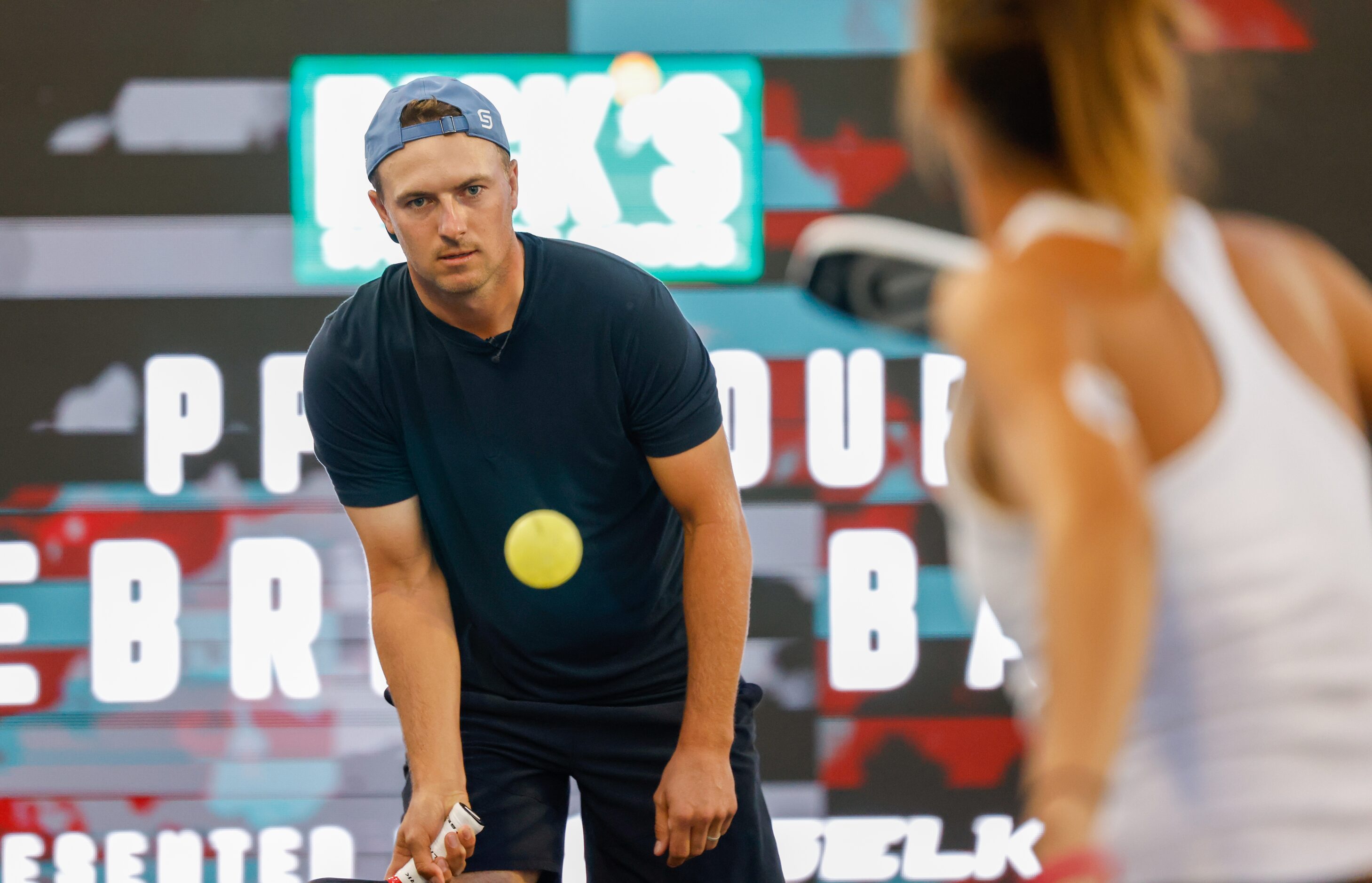 Jordan Spieth (left) warms up with Lea Jansen before playing several doubles matches of...