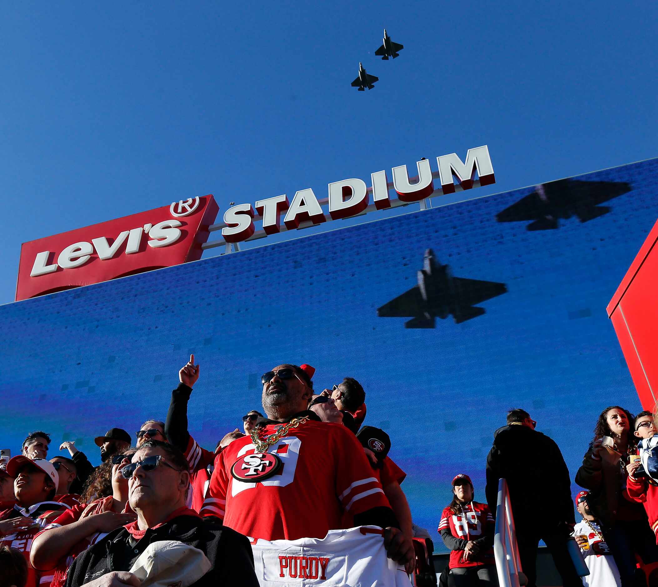 A pair of F-35C’s from the Naval Strike Fighter Squadron 147 perform the flyover of  Levi’s...