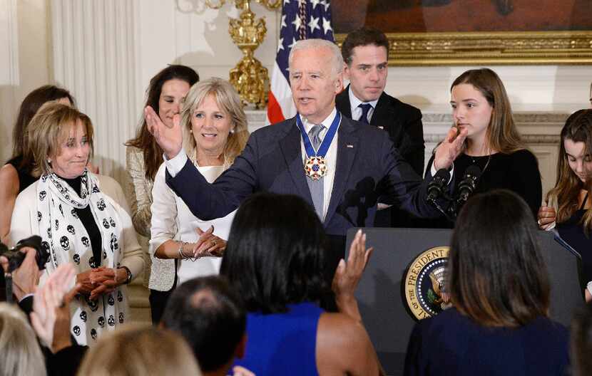 Vice-President Biden gestures after he received the Medal of Freedom from President Obama...