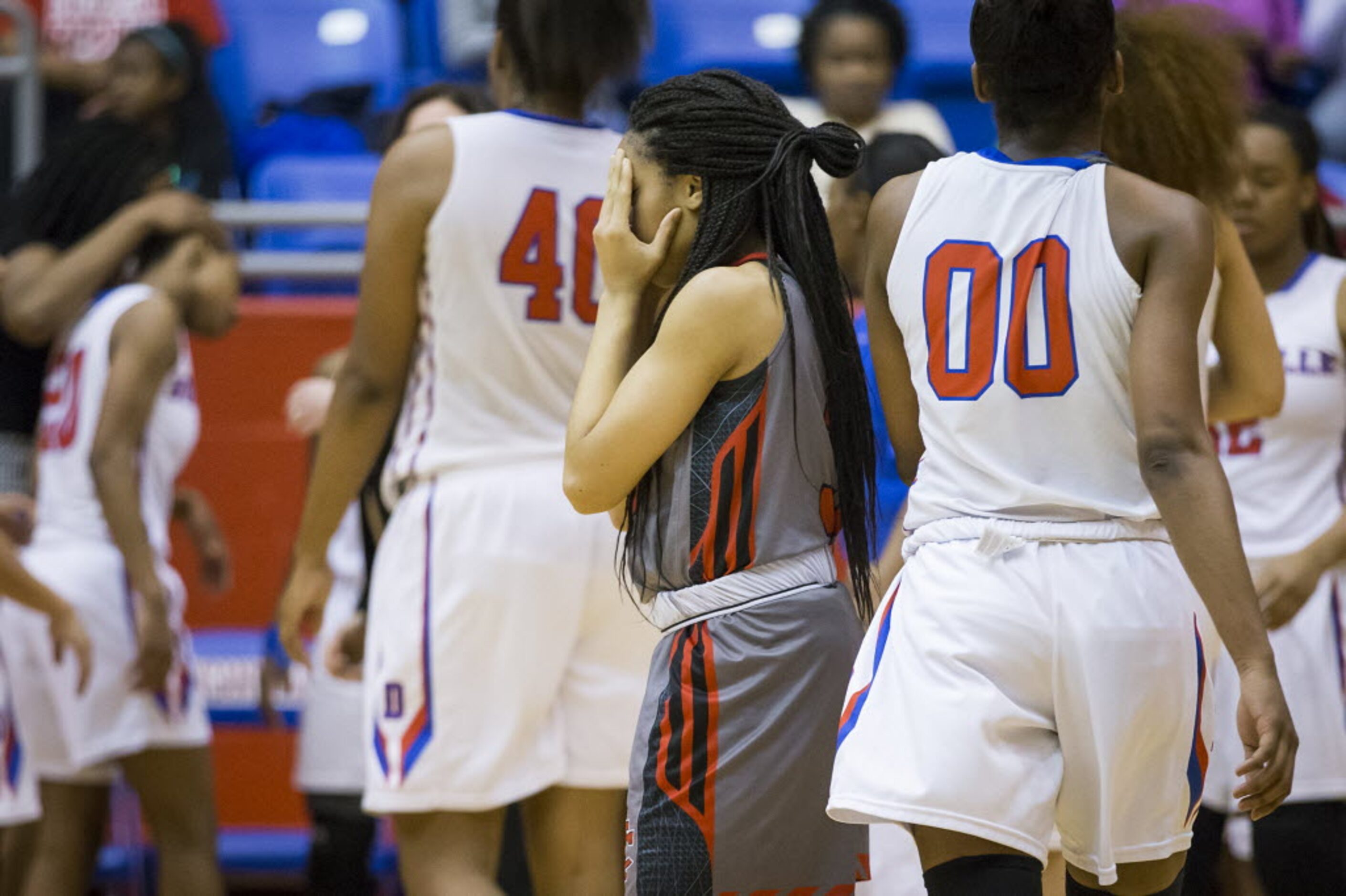 Cedar Hill guard Lindsey Ogbonna (3) reacts after a baskets by Duncanville forward Zarielle...