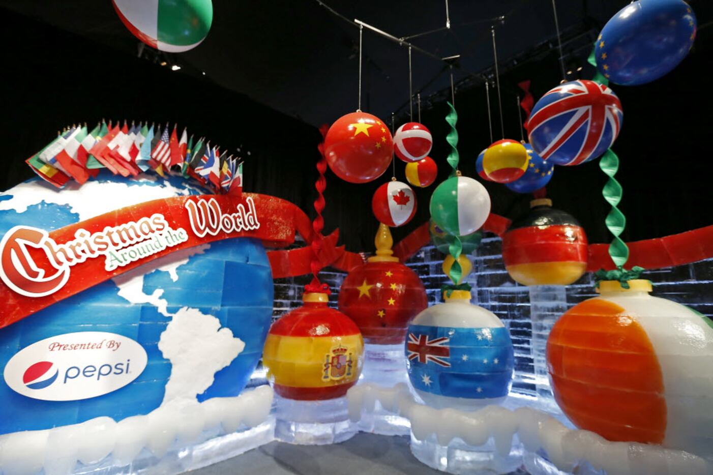 The Ice! exhibit features the Christmas Around the World theme showing flags from countries...