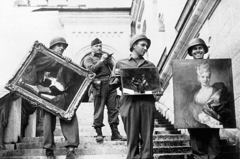  American GIs [ the monuments men ] hand-carried paintings down the steps of the...