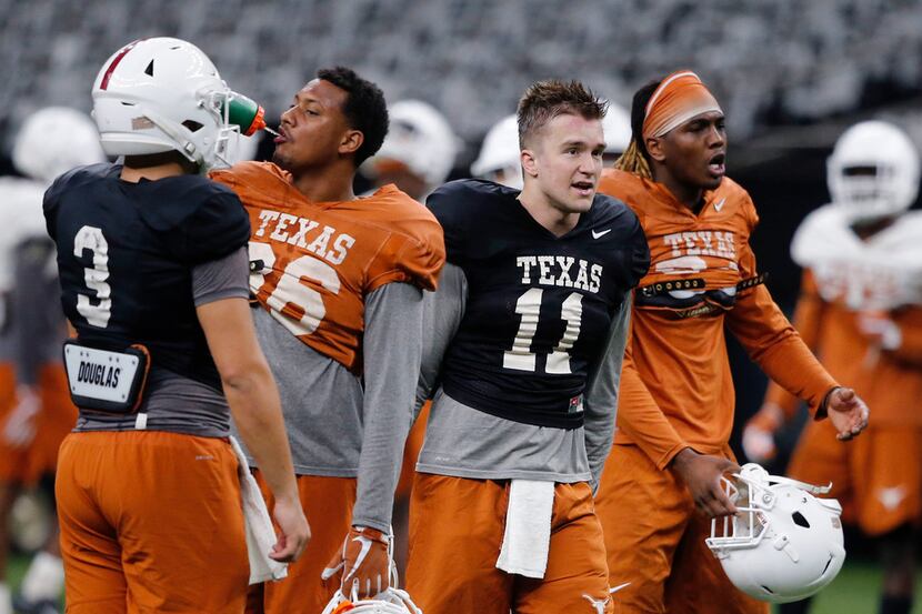 Texas quarterback Cameron Rising (3), wide receiver Jordan Pouncey (86), quarterback Sam...