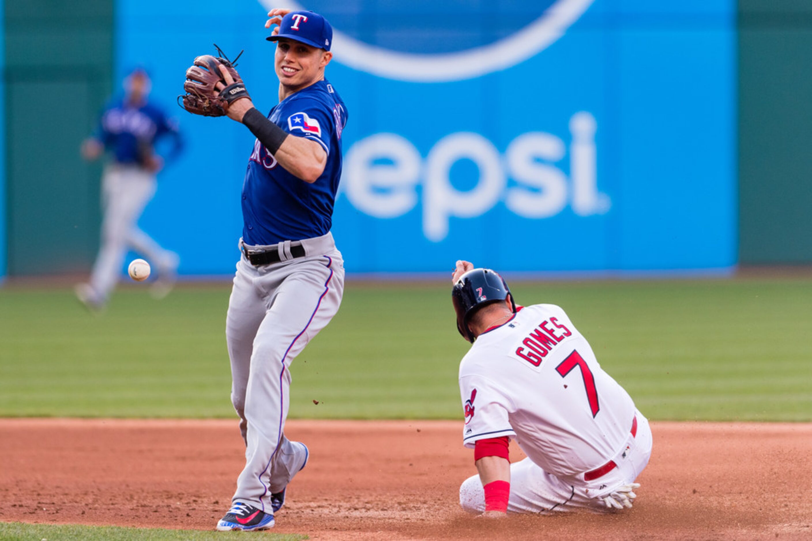 CLEVELAND, OH - APRIL 30: Second baseman Drew Robinson #18 of the Texas Rangers drops the...