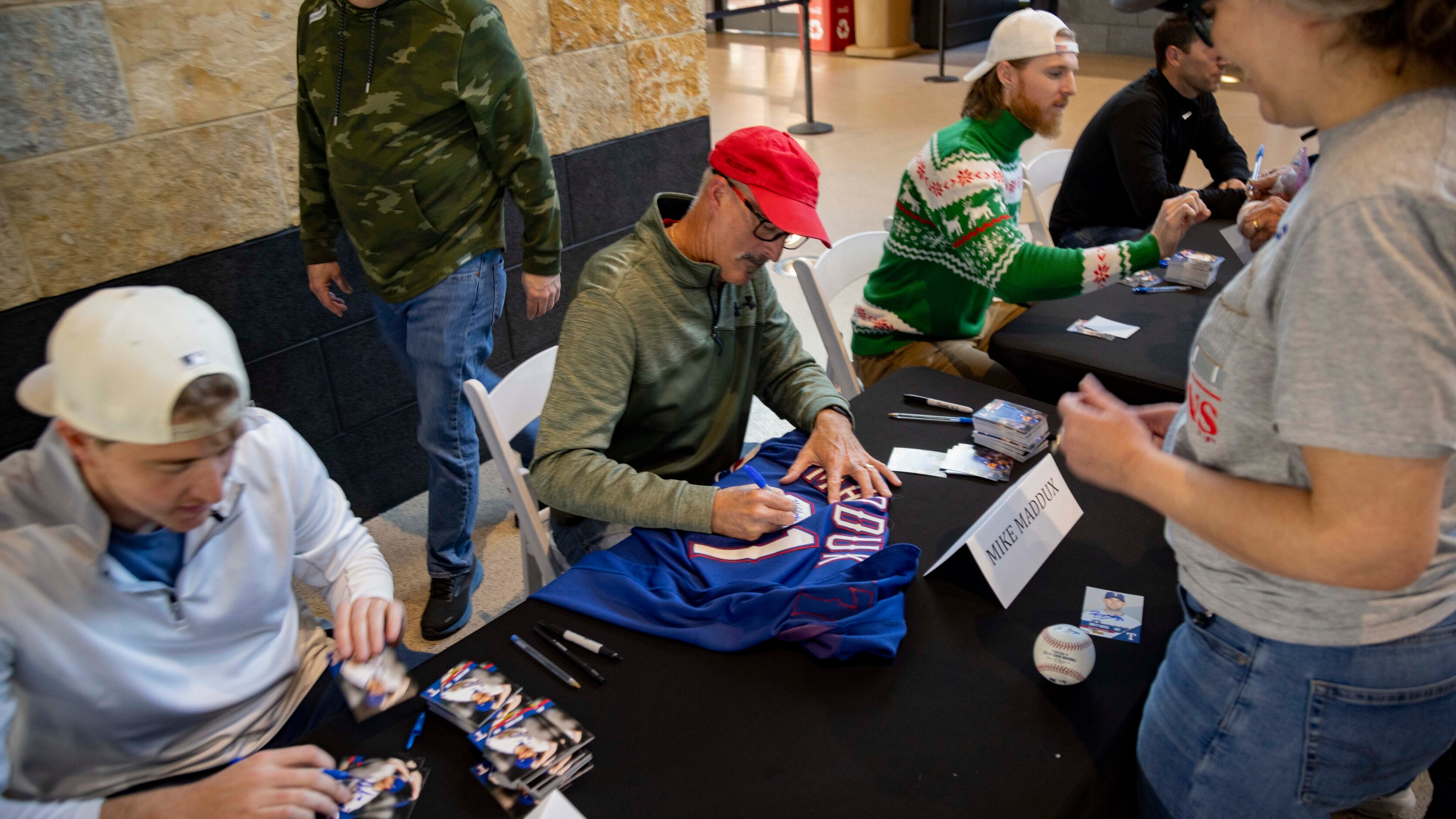 (From left) Rangers relief pitcher Josh Sborz (66), pitching coach Mike Maddux and starting...