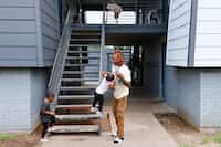 Veon Alexander, whose family has lived at the Volara Apartments for 18 months, picks up his...