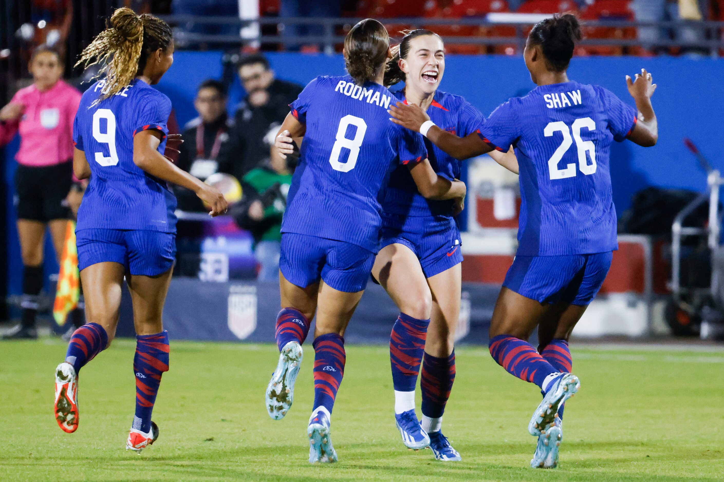 United States midfielder Sam Coffey (back right) celebrates a goal her teammates during the...