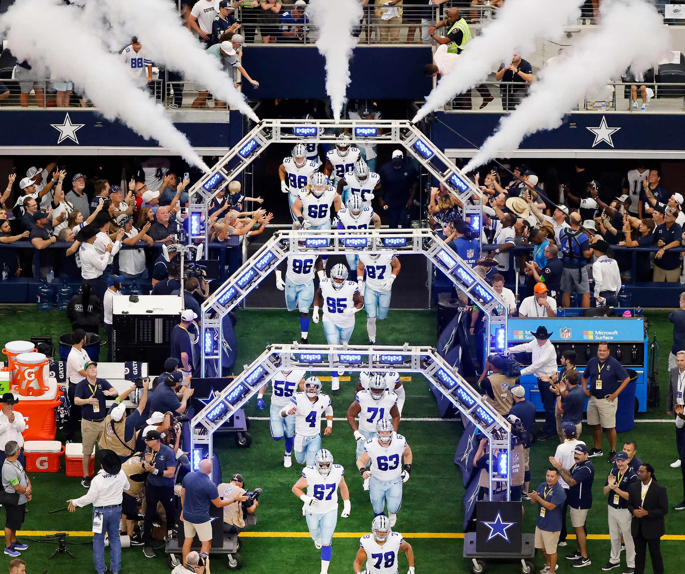 The Dallas Cowboys run onto the field for their home opener against the New York Jets at...