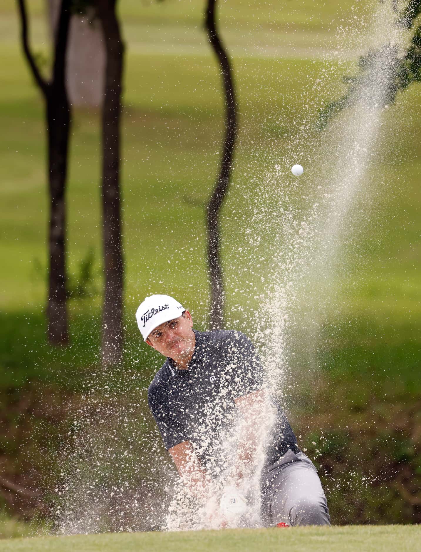 Joseph Bramlett hits out of a bunker on the 7th hole during round 2 of the AT&T Byron Nelson...
