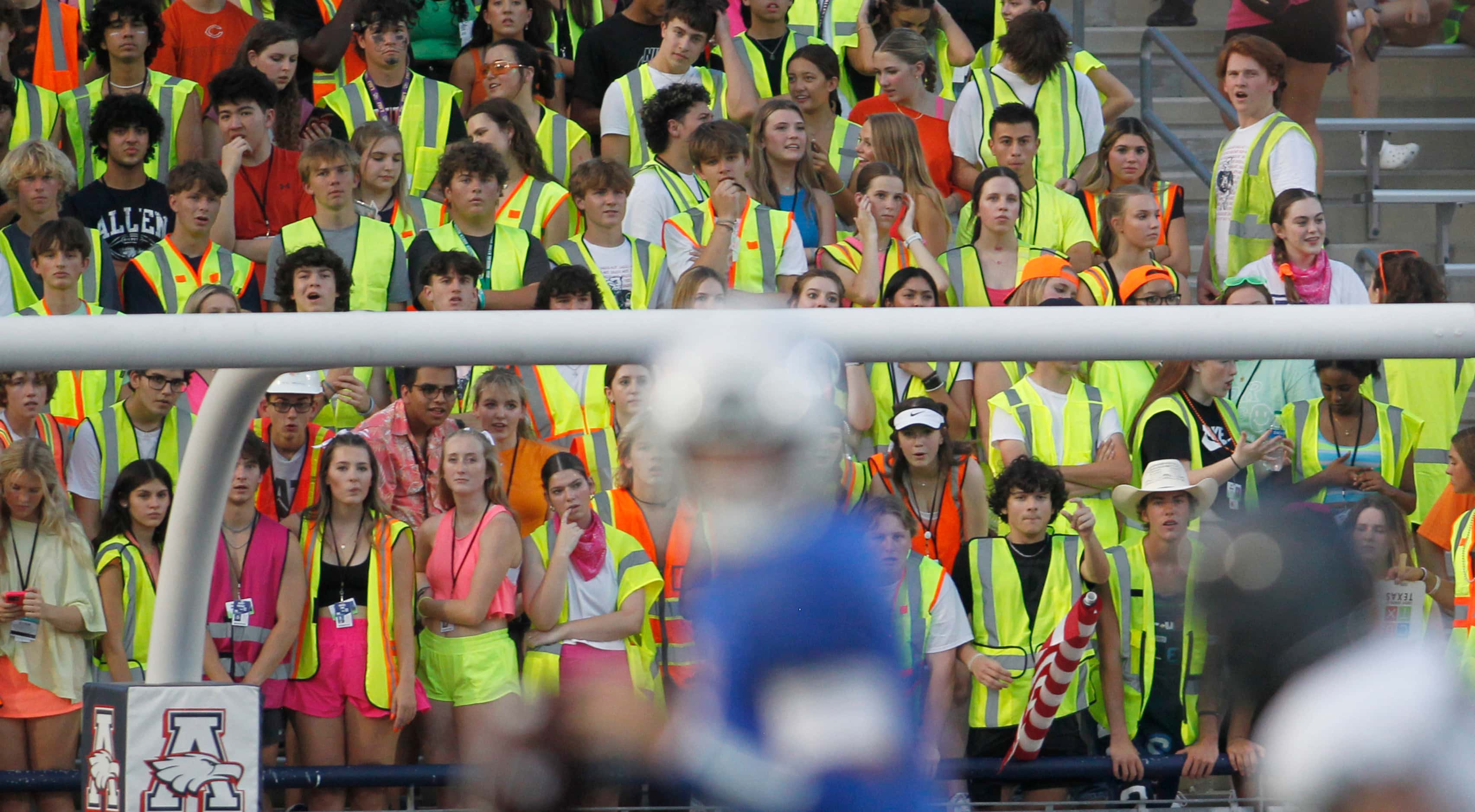 Allen Eagles fans filling the student section look on from the end zone as Allen quarterback...