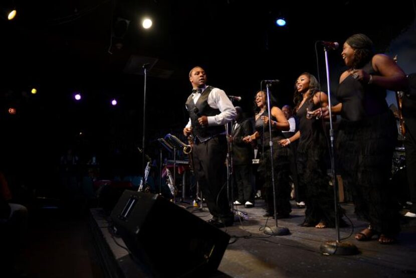 
“Lil Larry” Gordon, son of Balch Springs Mayor Carrie Gordon (behind him, left), sings The...