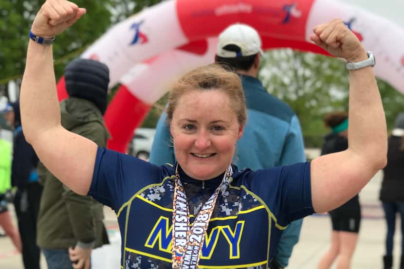 Emily Susan Law, 49, celebrates after a triathlon in April 2018.