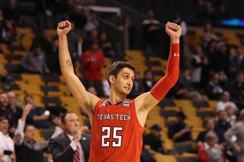 BOSTON, MA - MARCH 23:  Davide Moretti #25 of the Texas Tech Red Raiders celebrates...