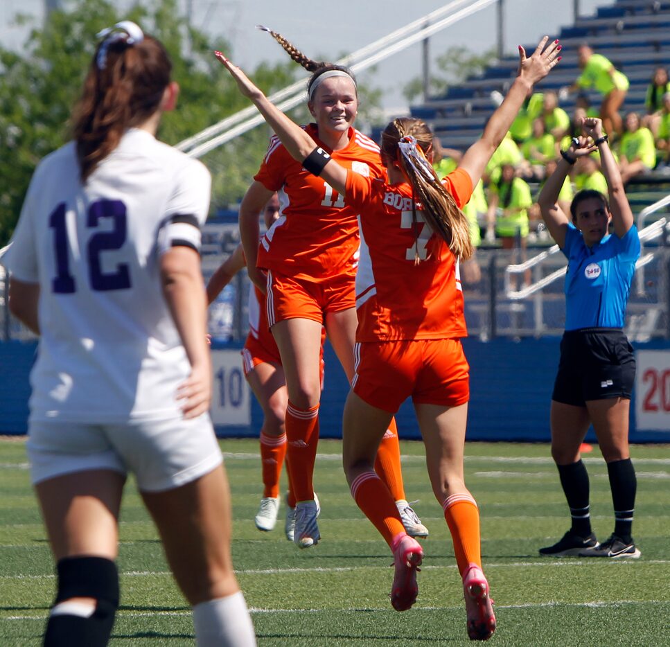 Celina's Madi Vana (11), center, leaps in celebration of teammate Lexi Tuite's (7) goal...