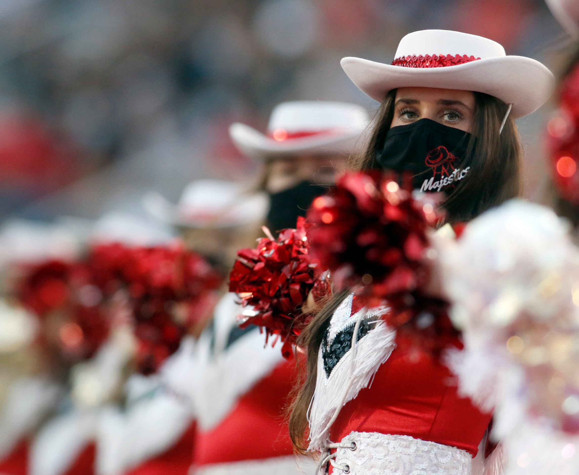 Argyle Eagles drill team members perform during a pre-game performance on the field before...