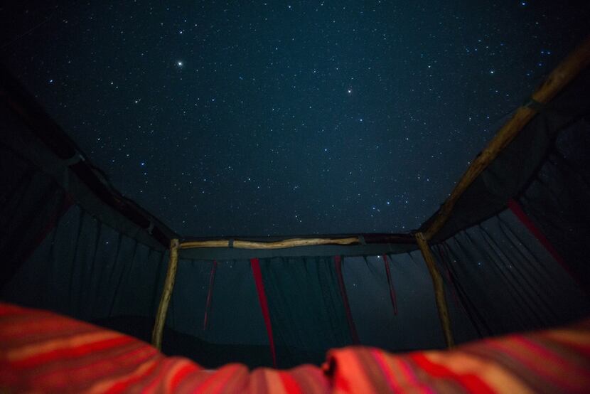 Guests sleep under the night sky at the Loisaba Star Beds. 