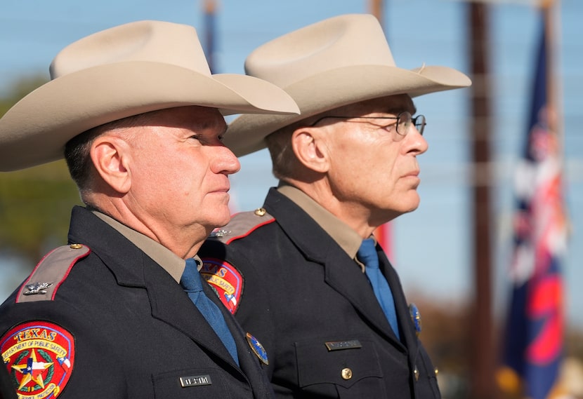 Incoming Texas Department of Public Safety Director Freeman Martin, left, and outgoing...