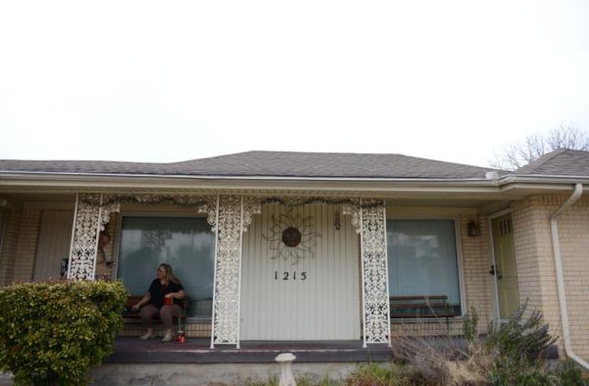 
Church members James Ross (left) and Terry Guyton chat on the porch of Sacred Journey...