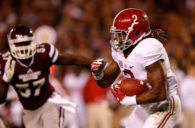 STARKVILLE, MS - NOVEMBER 14:  Derrick Henry #2 of the Alabama Crimson Tide rushes against...