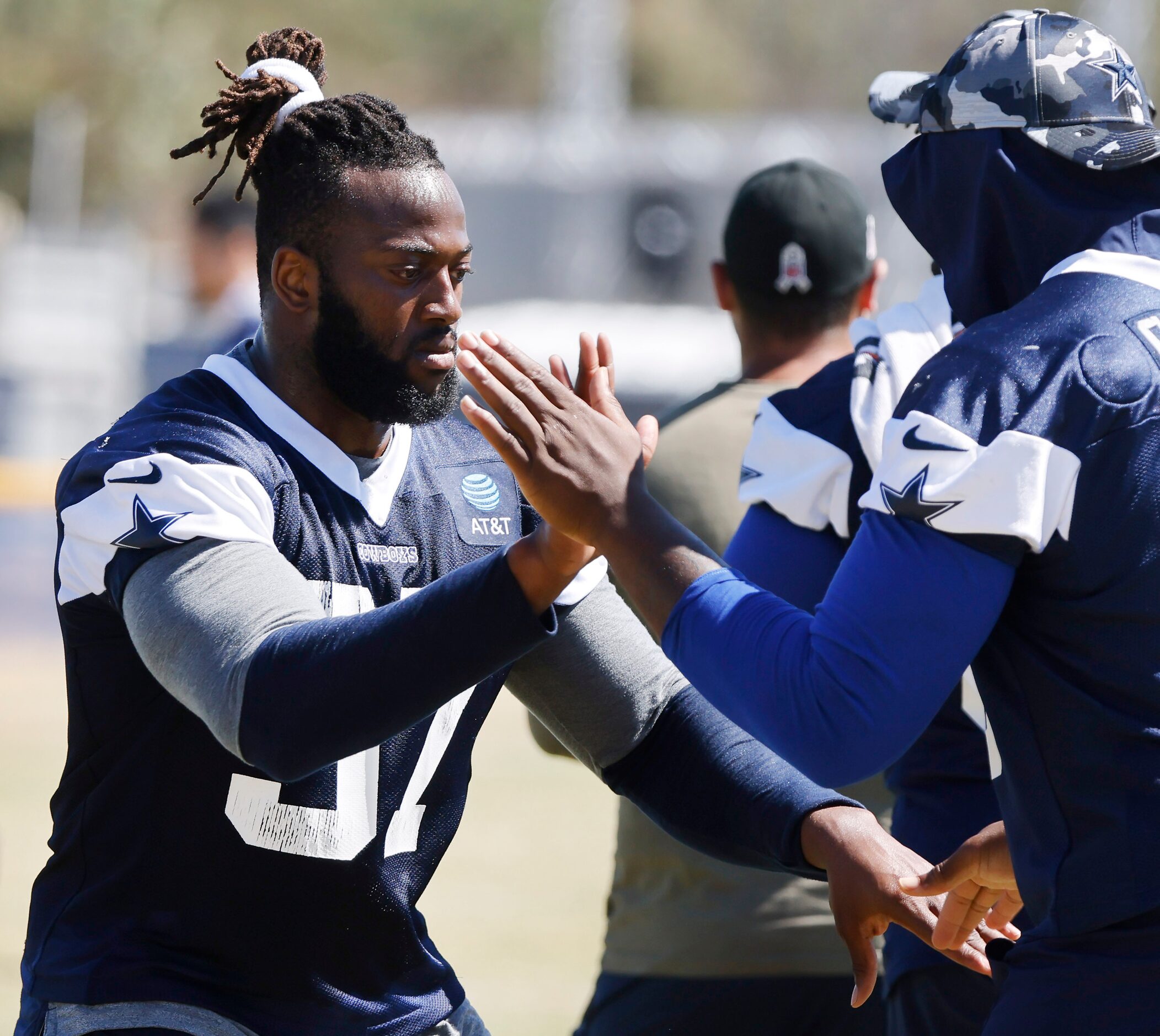 Dallas Cowboys defensive tackle Osa Odighizuwa (97) and defensive end Chauncey Golston (99)...