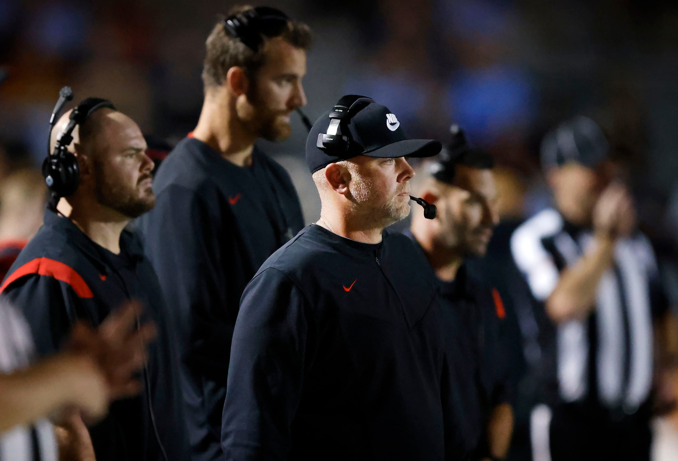 Euless Trinity head coach Aaron Lineweaver and his staff watch as their team faces Hurst...