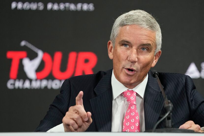 PGA Tour Commissioner Jay Monahan gestures during a press conference at East Lake Golf Club...