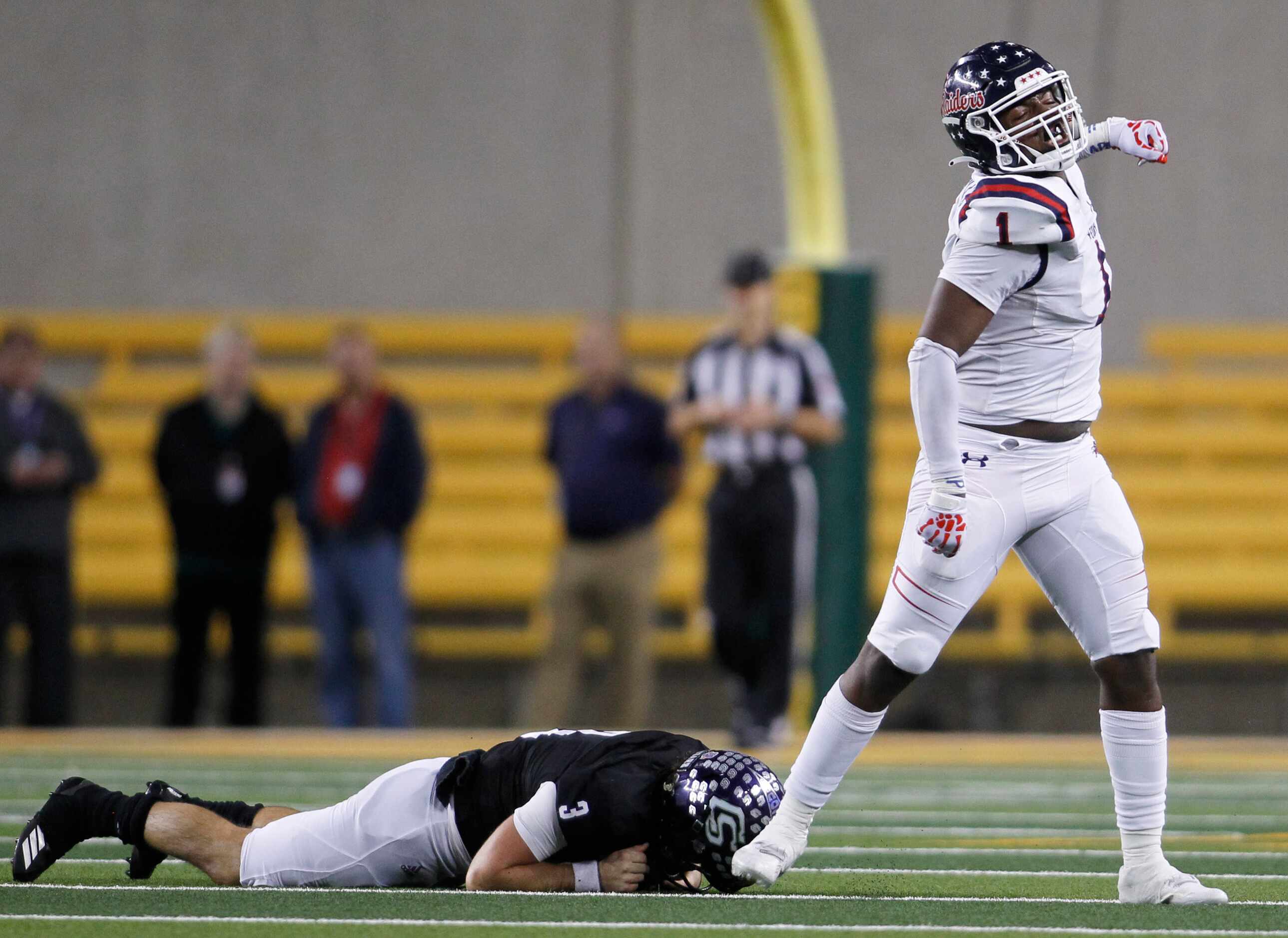 Denton Ryan defensive lineman MarQuice Hill ll (1) celebrates his sack of College Station...