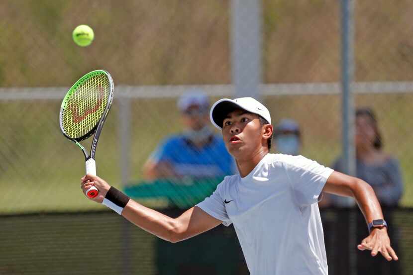Frisco Heritage's Liam Selvido returns a point in a 5A boys doubles match. UIL state tennis...
