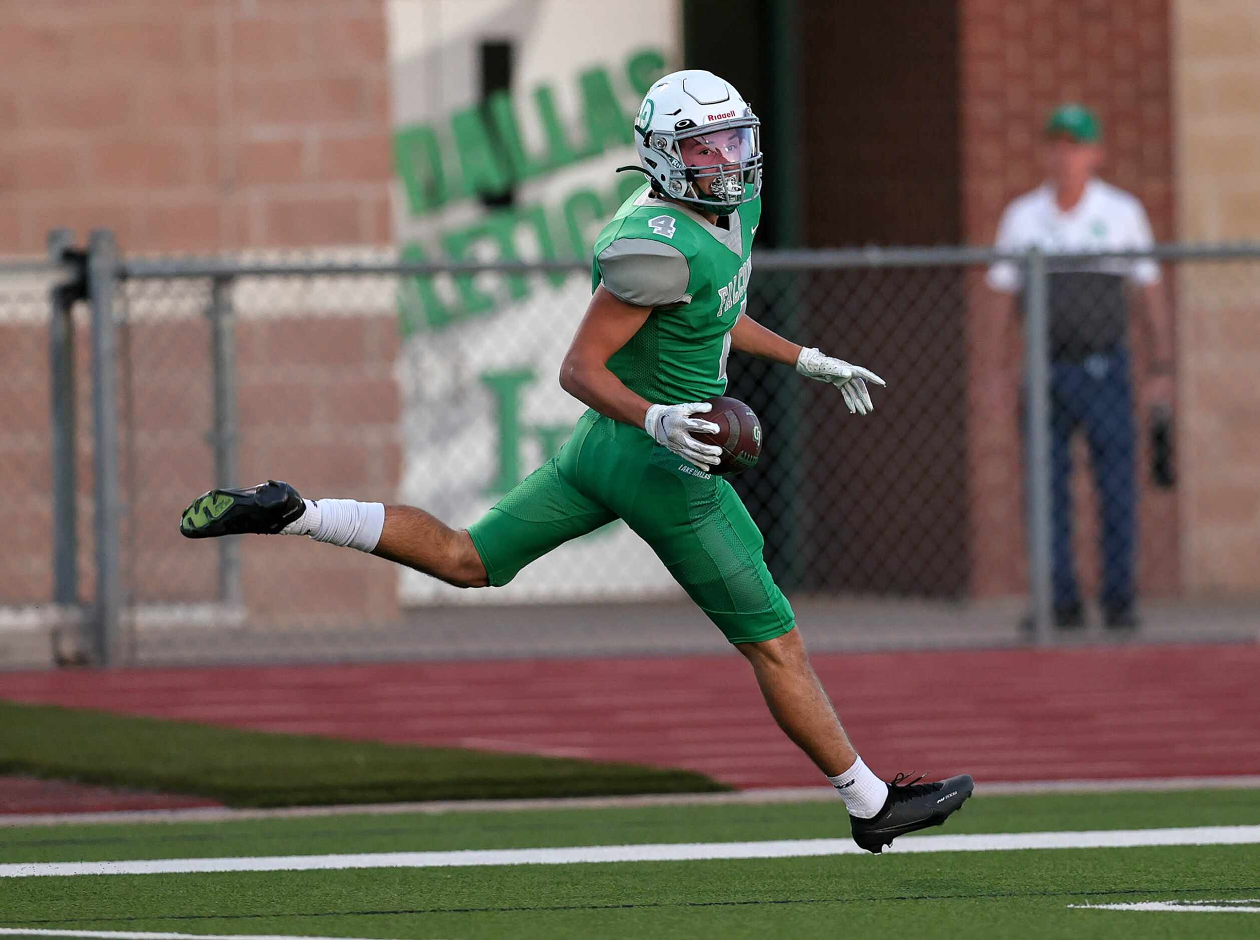 Lake Dallas running back Dylan Brauchle (4) goes into the endzone for a touchdown run...